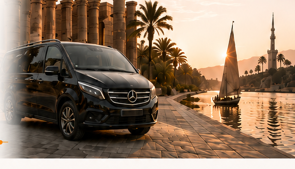 A private transfer van beside the Nile at sunset